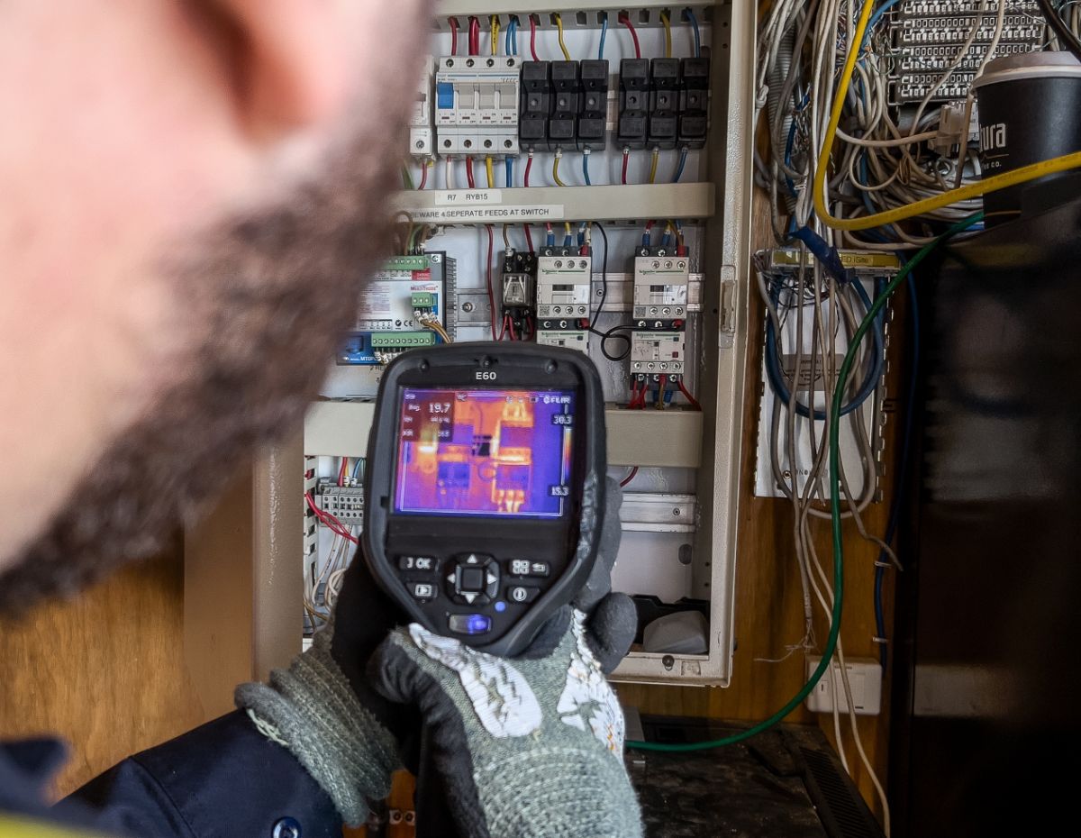NZ Thermography technician imaging a live switchboard